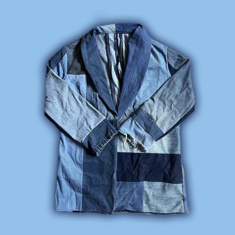 A one-of-a-kind, upcycled jacket made from denim jeans. These jeans would have otherwise ended up in a landfill had they not been salvaged by Mason, the fashion designer behind SCAL Studio